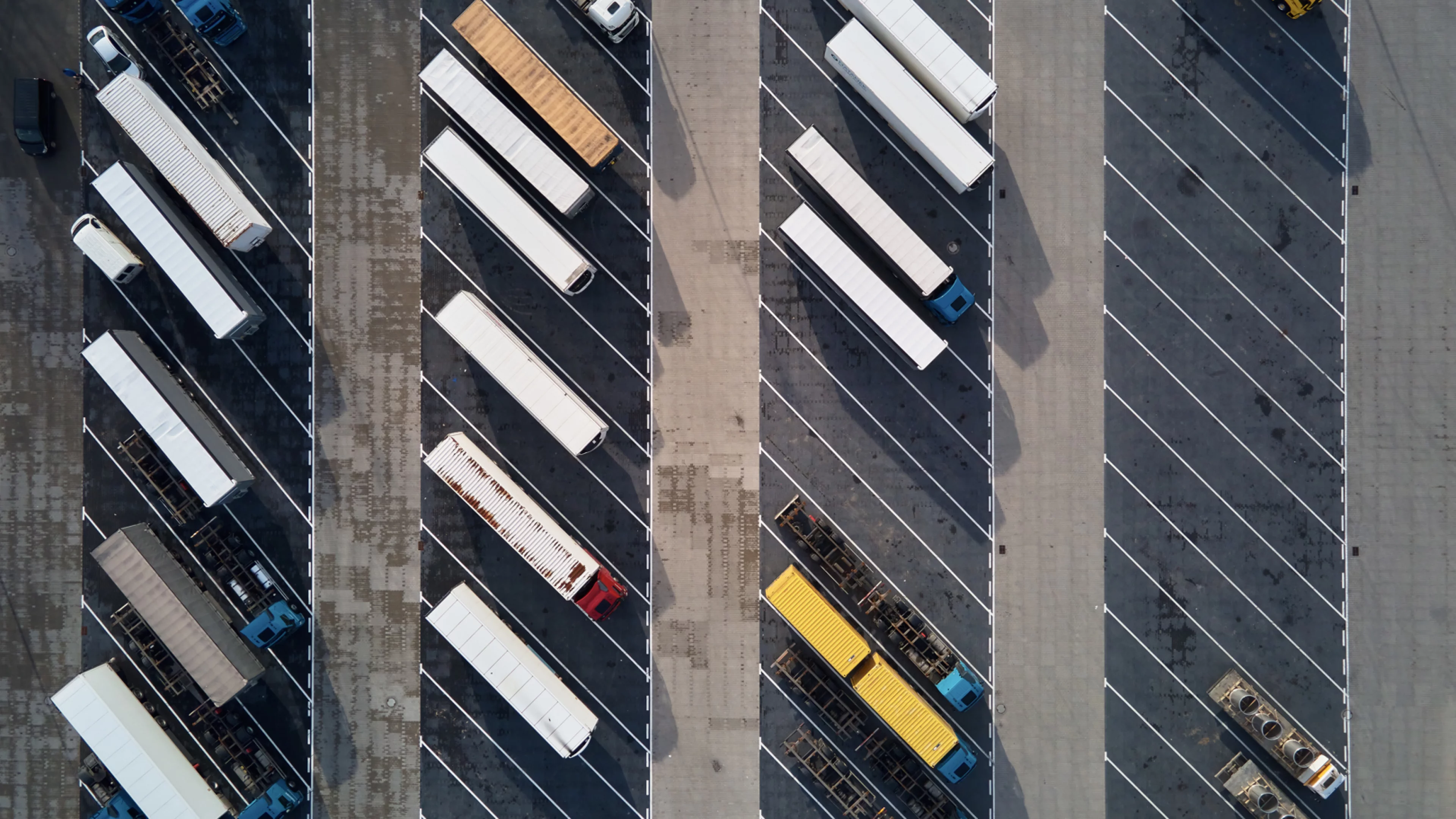 top-view-trucks-parking-lot-near-logistic-warehouse.jpg