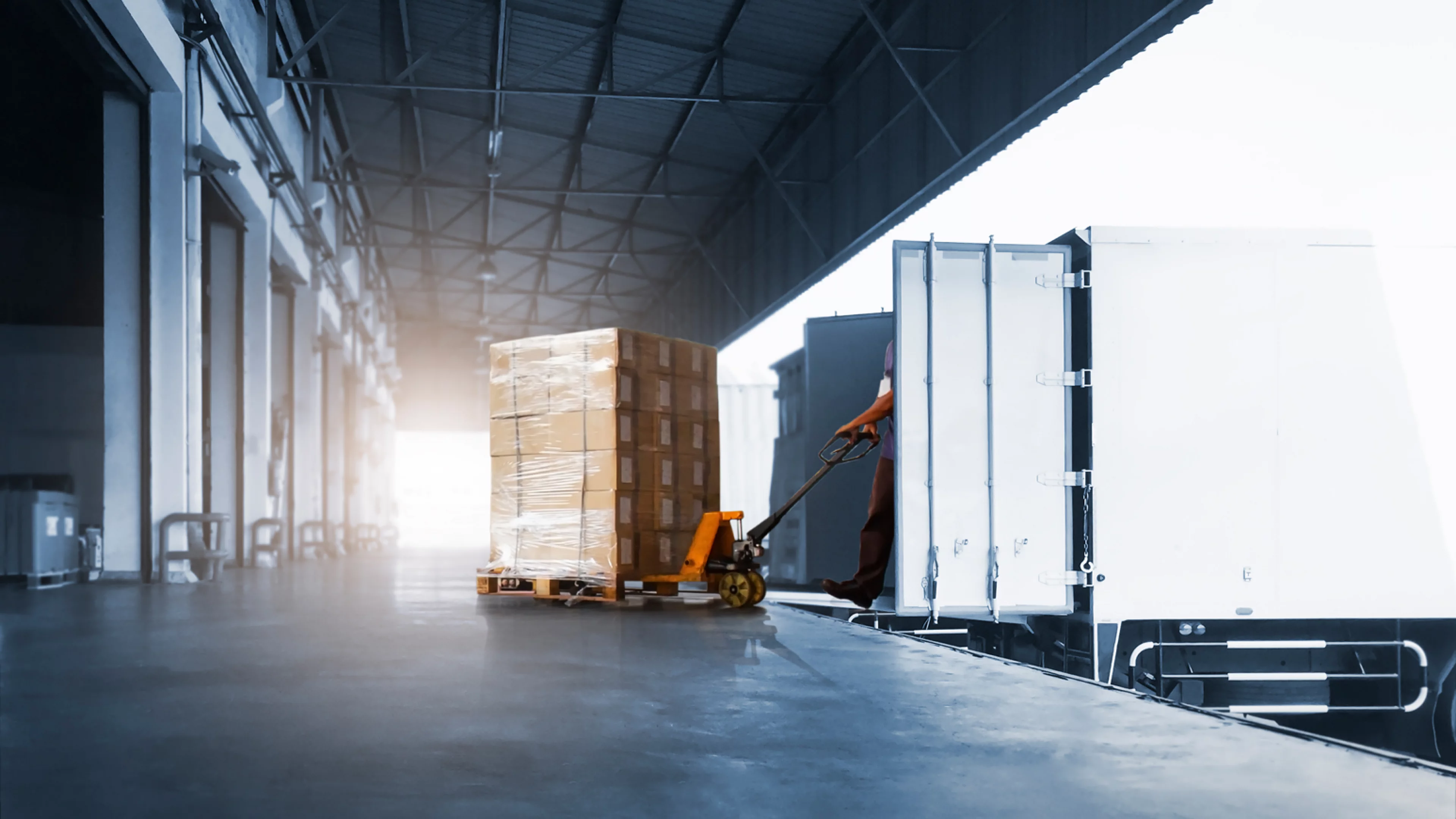 workers-unloading-package-boxes-into-cargo-container-loading-dock-warehouse-cargo-shipping-transport.jpg
