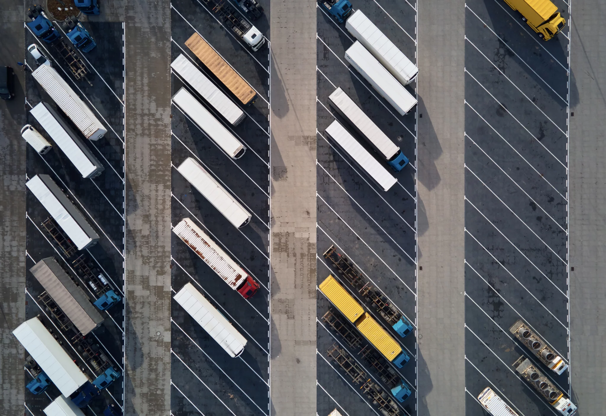 top-view-trucks-parking-lot-near-logistic-warehouse.jpg